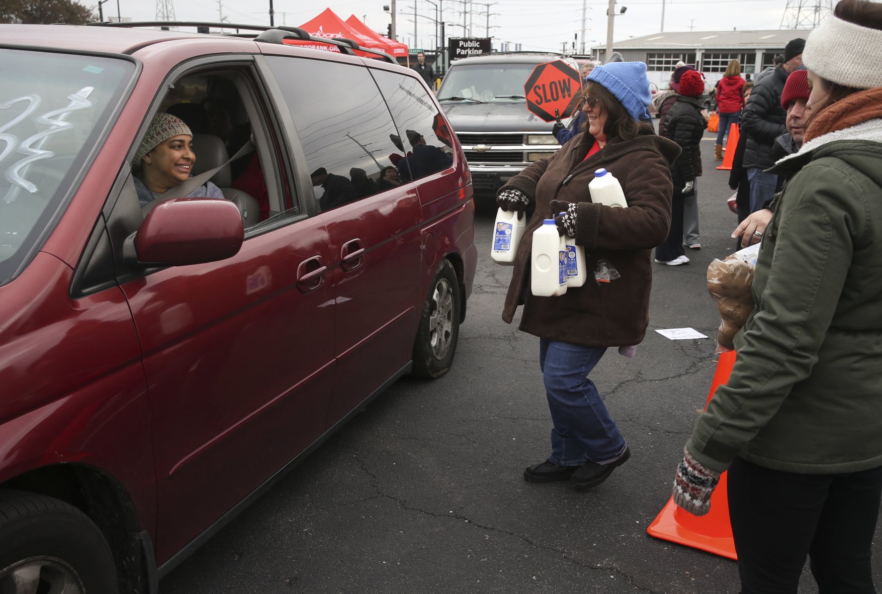 Volunteers hand out food during 'Thanksgiving Together' event